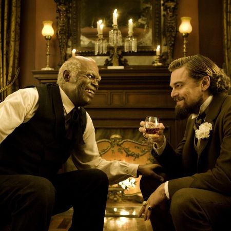 Both Samuel L. Jackson and Leonardo DiCaprio laughing.